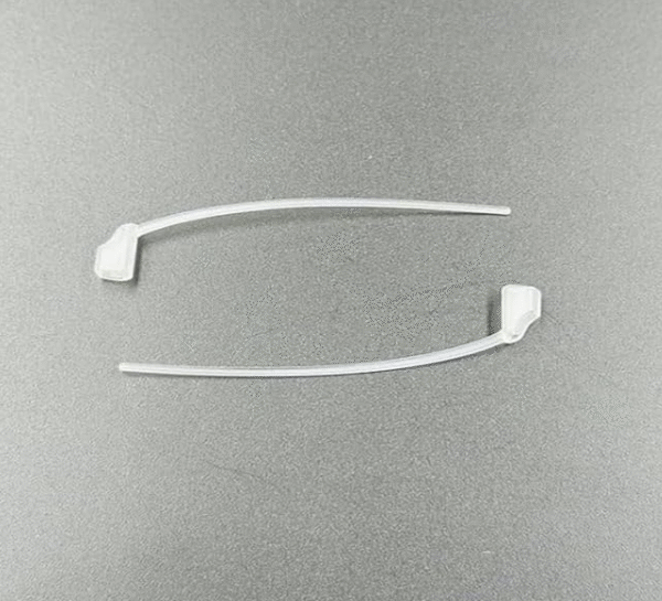 Pair of Oticon 85 gain receiver retention locks / tails